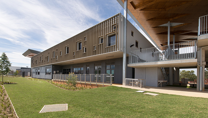 Exterior of two storey building with landscaping