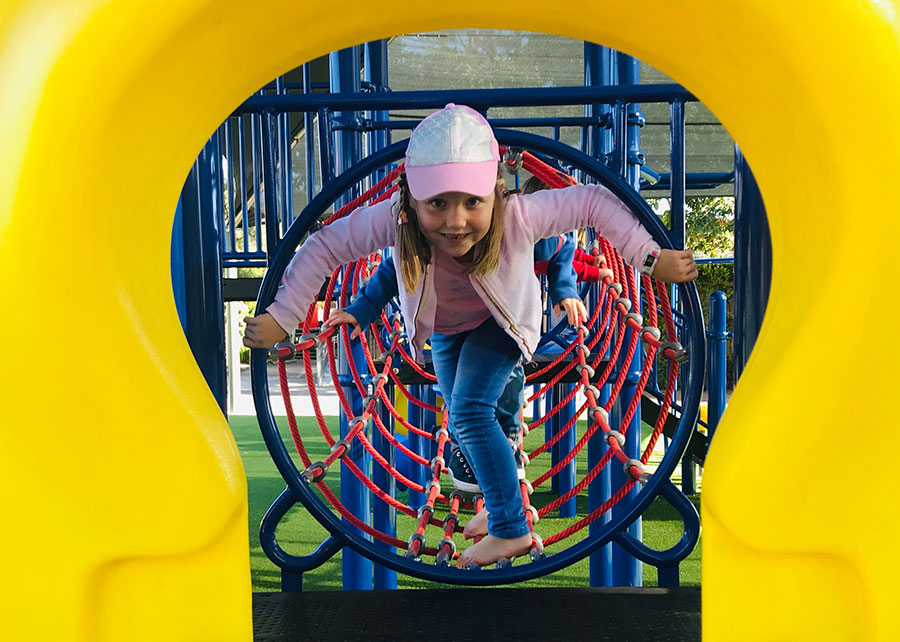 Placeholder image Young girl on playground equipment